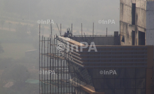 Smog, construction worker